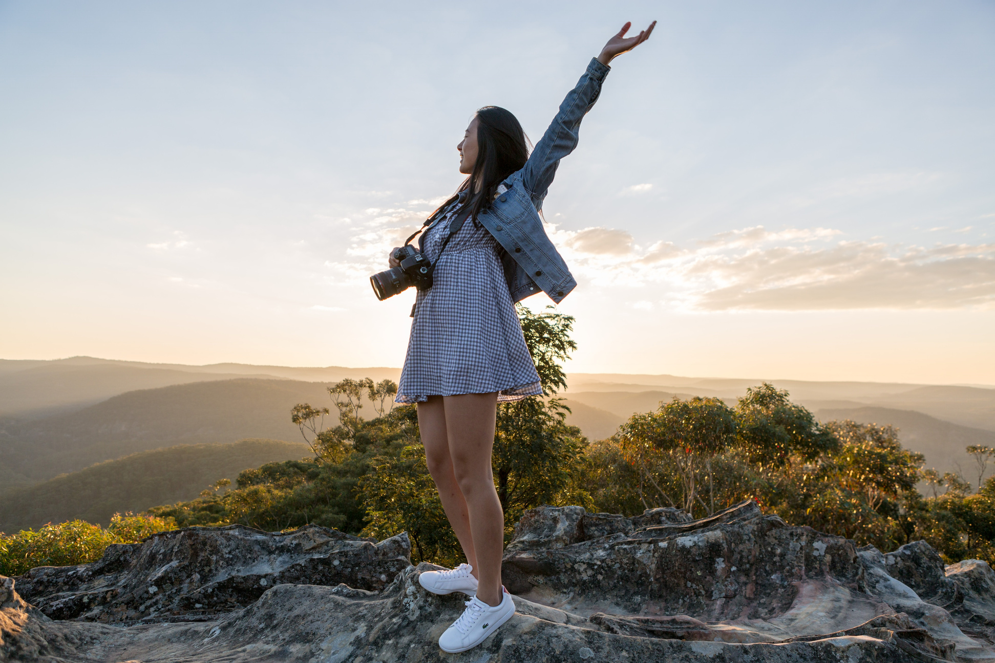 Woman in Gray Dress on Top of Mountain